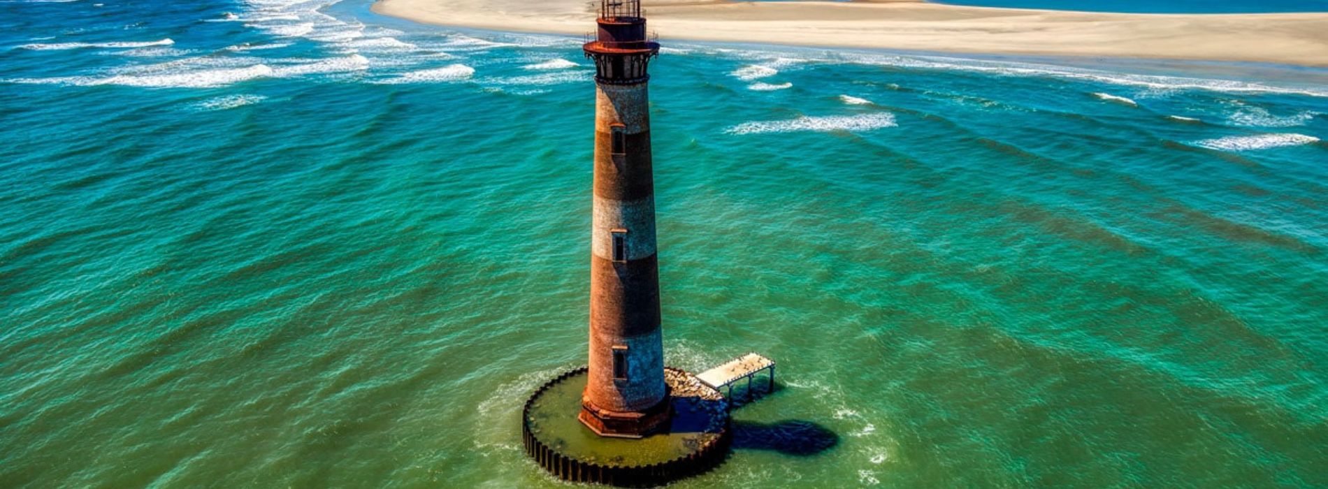 A lighthouse is located on a small island - Madeinsea©