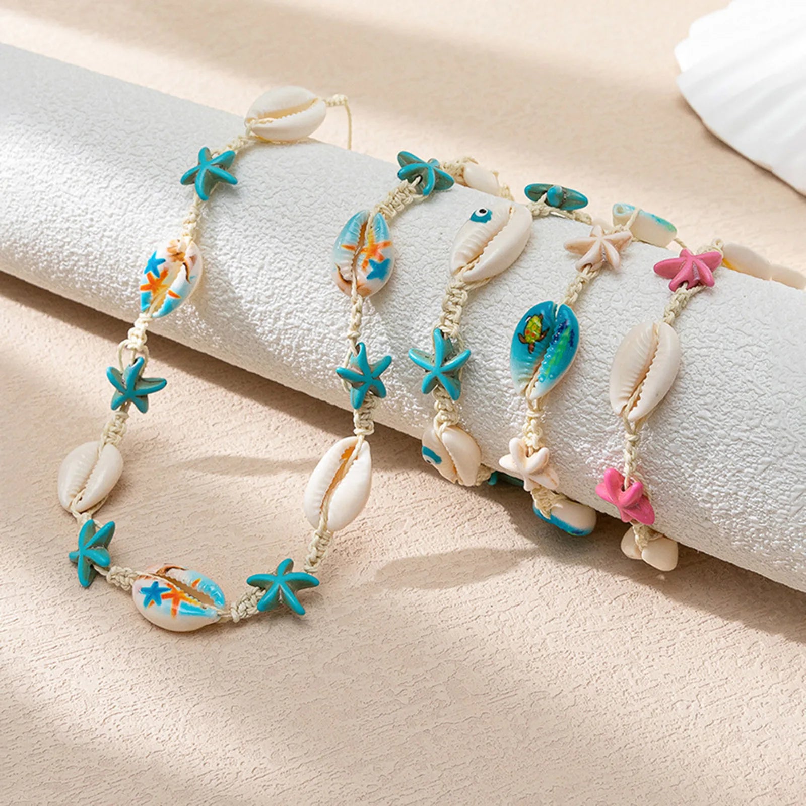 Pulseras trenzadas de concha oceánica con estrella de mar blanca y azul